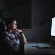 woman working late long hours featured